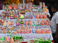 People Buy Hindu Goddess Lakshmi Idols And Other Dolls For Worship During The Upcoming Hindu Festival Diwali, The Hindu Festival Of Lights O...