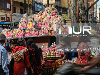 People Buy Hindu Goddess Lakshmi Idols And Other Dolls For Worship During The Upcoming Hindu Festival Diwali, The Hindu Festival Of Lights O...