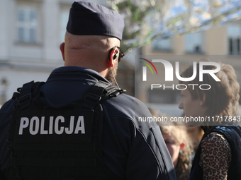 Police participate in a protest against the suspension of asylum law  at the Main Square in Krakow, Poland, on October 27, 2024. The new mig...