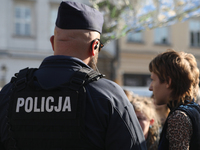 Police participate in a protest against the suspension of asylum law  at the Main Square in Krakow, Poland, on October 27, 2024. The new mig...