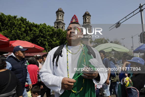 A person dresses as Saint Jude Thaddeus outside the Church of San Hipolito in Mexico City, Mexico, on October 28, 2024, as the church receiv...