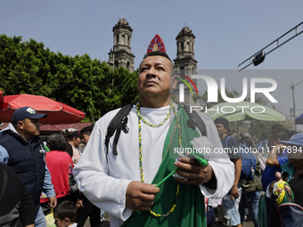 A person dresses as Saint Jude Thaddeus outside the Church of San Hipolito in Mexico City, Mexico, on October 28, 2024, as the church receiv...