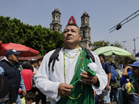 A person dresses as Saint Jude Thaddeus outside the Church of San Hipolito in Mexico City, Mexico, on October 28, 2024, as the church receiv...