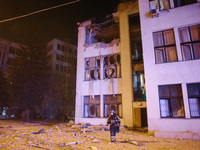 A firefighter stands near the affected building , on October 28, 2024, In The Center Of Kharkiv, Ukraine. (