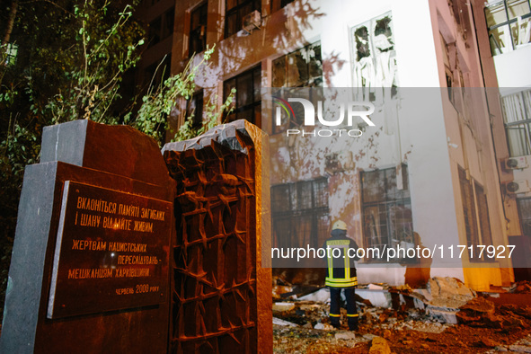 A monument to Kharkiv residents, victims of Nazi persecution, stands next to the damaged building , on October 28, 2024, In The Center Of Kh...