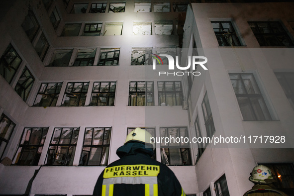 Firefighters inspect the building , on October 28, 2024, In The Center Of Kharkiv, Ukraine. 