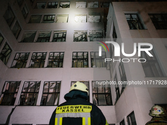 Firefighters inspect the building , on October 28, 2024, In The Center Of Kharkiv, Ukraine. (