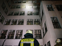 Firefighters inspect the building , on October 28, 2024, In The Center Of Kharkiv, Ukraine. (