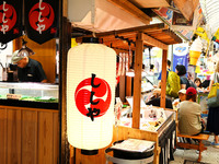 People shop at Heimitsu Shop Street in Naha, Japan, on October 28, 2024. (