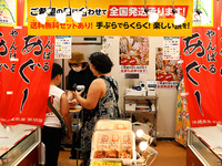 People shop at Heimitsu Shop Street in Naha, Japan, on October 28, 2024. (