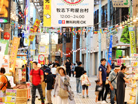 People shop at Heimitsu Shop Street in Naha, Japan, on October 28, 2024. (