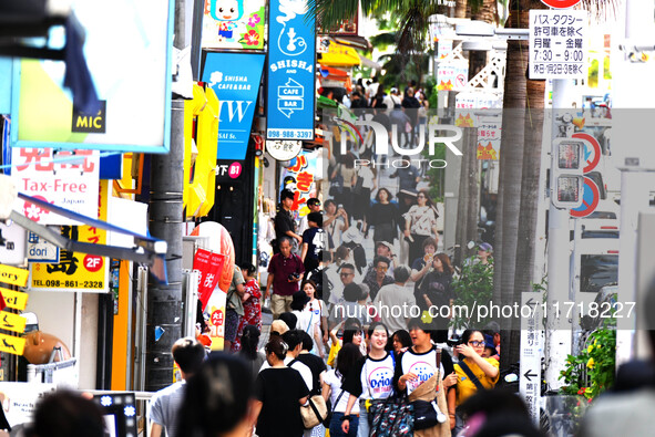 People shop at Heimitsu Shop Street in Naha, Japan, on October 28, 2024. 