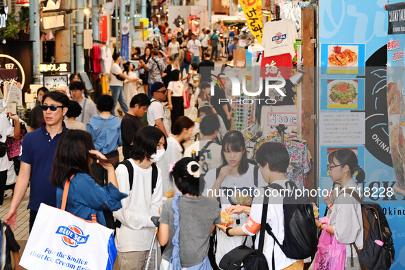 People shop at Heimitsu Shop Street in Naha, Japan, on October 28, 2024. 