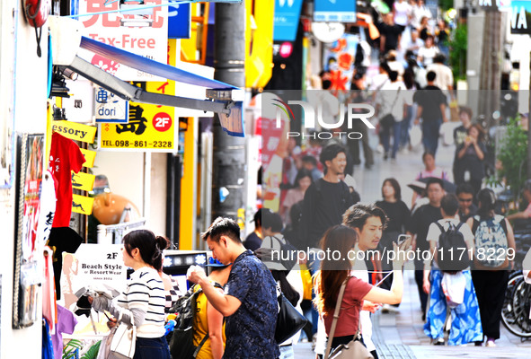 People shop at Heimitsu Shop Street in Naha, Japan, on October 28, 2024. 