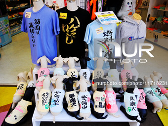 People shop at Heimitsu Shop Street in Naha, Japan, on October 28, 2024. (