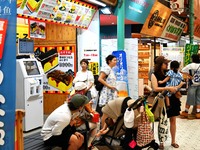 People shop at Heimitsu Shop Street in Naha, Japan, on October 28, 2024. (