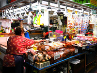 People shop at Heimitsu Shop Street in Naha, Japan, on October 28, 2024. (