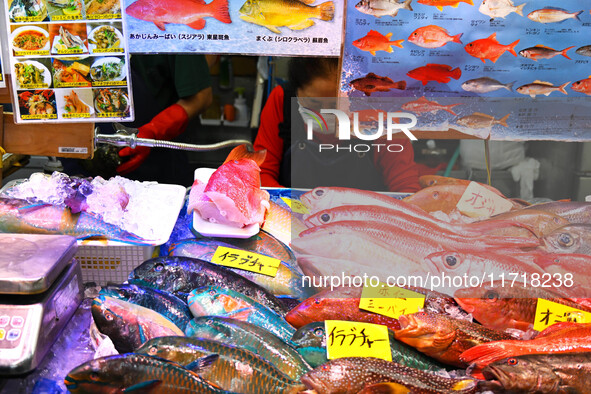 People shop at Heimitsu Shop Street in Naha, Japan, on October 28, 2024. 