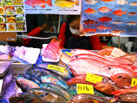 People shop at Heimitsu Shop Street in Naha, Japan, on October 28, 2024. (