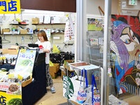 People shop at Heimitsu Shop Street in Naha, Japan, on October 28, 2024. (