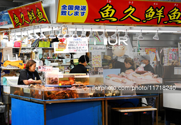 People shop at Heimitsu Shop Street in Naha, Japan, on October 28, 2024. 