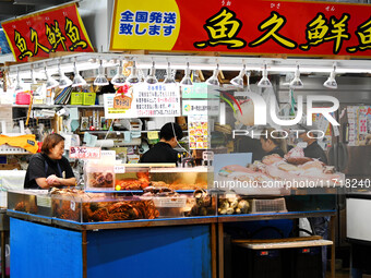 People shop at Heimitsu Shop Street in Naha, Japan, on October 28, 2024. (