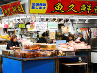 People shop at Heimitsu Shop Street in Naha, Japan, on October 28, 2024. (