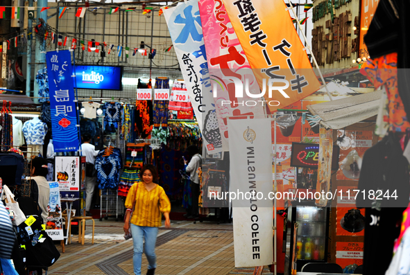 People shop at Heimitsu Shop Street in Naha, Japan, on October 28, 2024. 