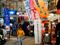 People shop at Heimitsu Shop Street in Naha, Japan, on October 28, 2024. (