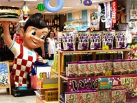 People shop at Heimitsu Shop Street in Naha, Japan, on October 28, 2024. (