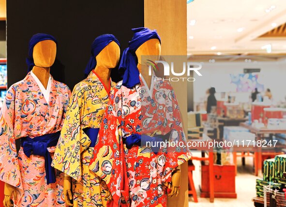 People shop at Heimitsu Shop Street in Naha, Japan, on October 28, 2024. 