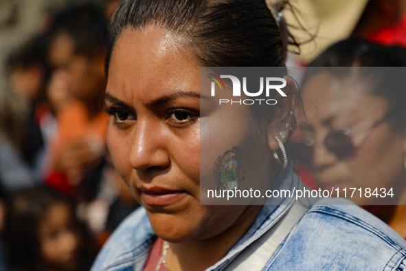 A devotee of Saint Jude Thaddeus attends the Church of San Hipolito to bless the images and give thanks for the favors granted in Mexico Cit...