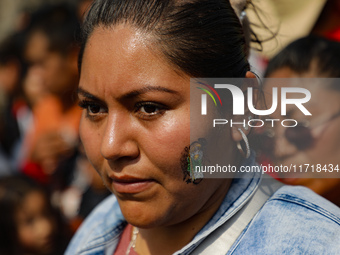 A devotee of Saint Jude Thaddeus attends the Church of San Hipolito to bless the images and give thanks for the favors granted in Mexico Cit...