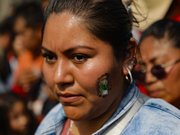 A devotee of Saint Jude Thaddeus attends the Church of San Hipolito to bless the images and give thanks for the favors granted in Mexico Cit...