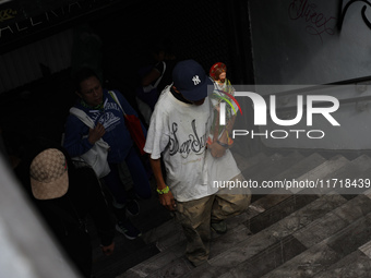 A devotee of Saint Jude Thaddeus attends the Church of San Hipolito to bless the images and give thanks for the favors granted in Mexico Cit...