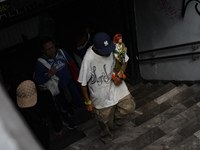 A devotee of Saint Jude Thaddeus attends the Church of San Hipolito to bless the images and give thanks for the favors granted in Mexico Cit...