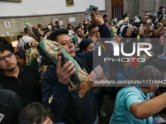 Devotees of Saint St. Jude Thaddeus attend the Church of San Hipolito to bless the images and give thanks for the favors granted in Mexico C...