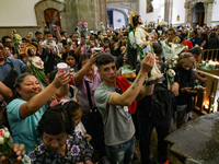 Devotees of Saint St. Jude Thaddeus attend the Church of San Hipolito to bless the images and give thanks for the favors granted in Mexico C...