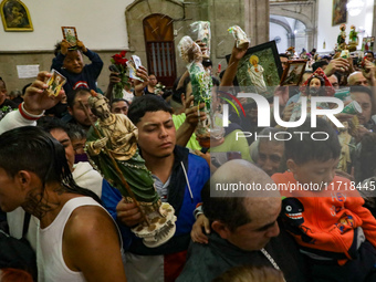 Devotees of Saint St. Jude Thaddeus attend the Church of San Hipolito to bless the images and give thanks for the favors granted in Mexico C...