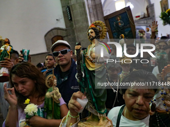 Devotees of Saint St. Jude Thaddeus attend the Church of San Hipolito to bless the images and give thanks for the favors granted in Mexico C...