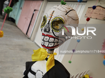 Residents of Santa Cecilia Tlahuac in Mexico City decorate public roads and houses on the eve of the Day of the Dead in Mexico City, on Octo...