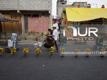 People attend to see decorations at Santa Cecilia Tlahuac in Mexico City, Mexico, on October 28, 2024, on the eve of Day of the Dead. (