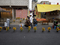 People attend to see decorations at Santa Cecilia Tlahuac in Mexico City, Mexico, on October 28, 2024, on the eve of Day of the Dead. (