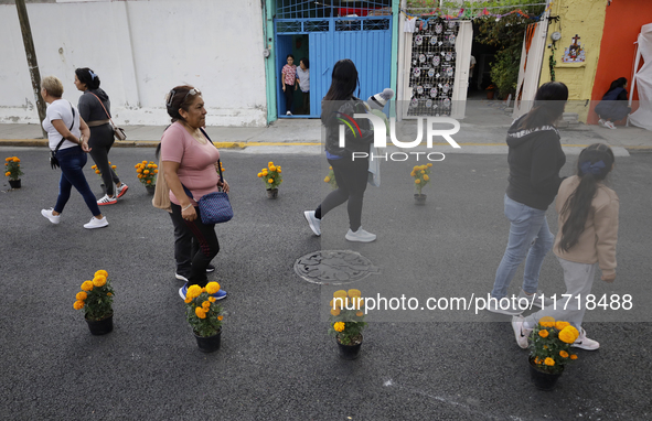 People attend to see decorations at Santa Cecilia Tlahuac in Mexico City, Mexico, on October 28, 2024, on the eve of Day of the Dead. 