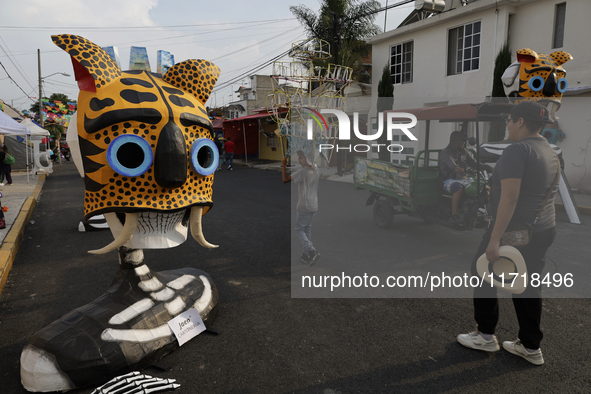 Residents of Santa Cecilia Tlahuac in Mexico City, Mexico, place pre-Hispanic decorations on public roads and houses on the eve of the Day o...