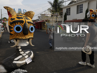 Residents of Santa Cecilia Tlahuac in Mexico City, Mexico, place pre-Hispanic decorations on public roads and houses on the eve of the Day o...