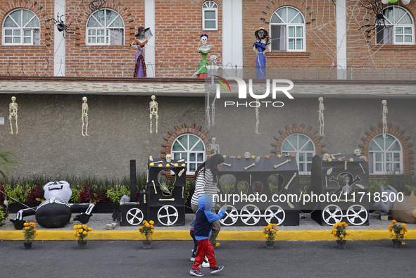 People attend to see decorations at Santa Cecilia Tlahuac in Mexico City, Mexico, on October 28, 2024, on the eve of Day of the Dead. 