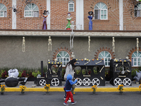 People attend to see decorations at Santa Cecilia Tlahuac in Mexico City, Mexico, on October 28, 2024, on the eve of Day of the Dead. (