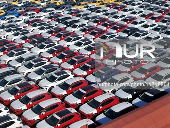 A large number of Chinese-made vehicles gather at Yantai Port waiting to be loaded for export in Yantai, Shandong province, China, on Octobe...