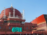 Workers produce ship hulls at Tuangang Community Shipbuilding base in Yanweigang town, Guanyun County, Lianyungang, China, on October 29, 20...